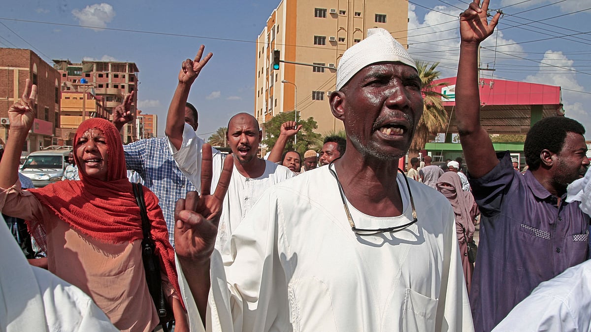 Supporters of the Umma Party, Sudan's largest political party, chant slogans during a protest against a military coup that overthrew the transition to civilian rule, on 29 October, 2021