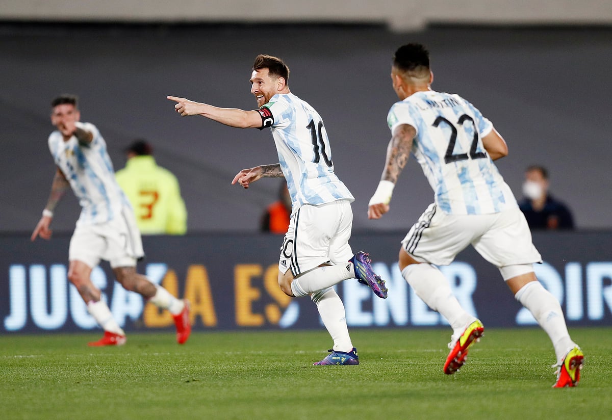 Lionel Messi celebrates scoring their first goal against Uruguay on 10 October