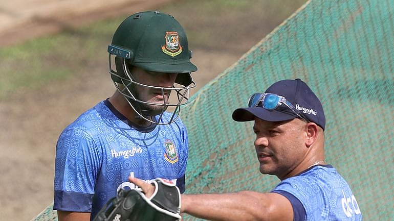 Bangladesh's batting coach Ashwell Prince giving advice to opener Mohammad Naim during a practice session