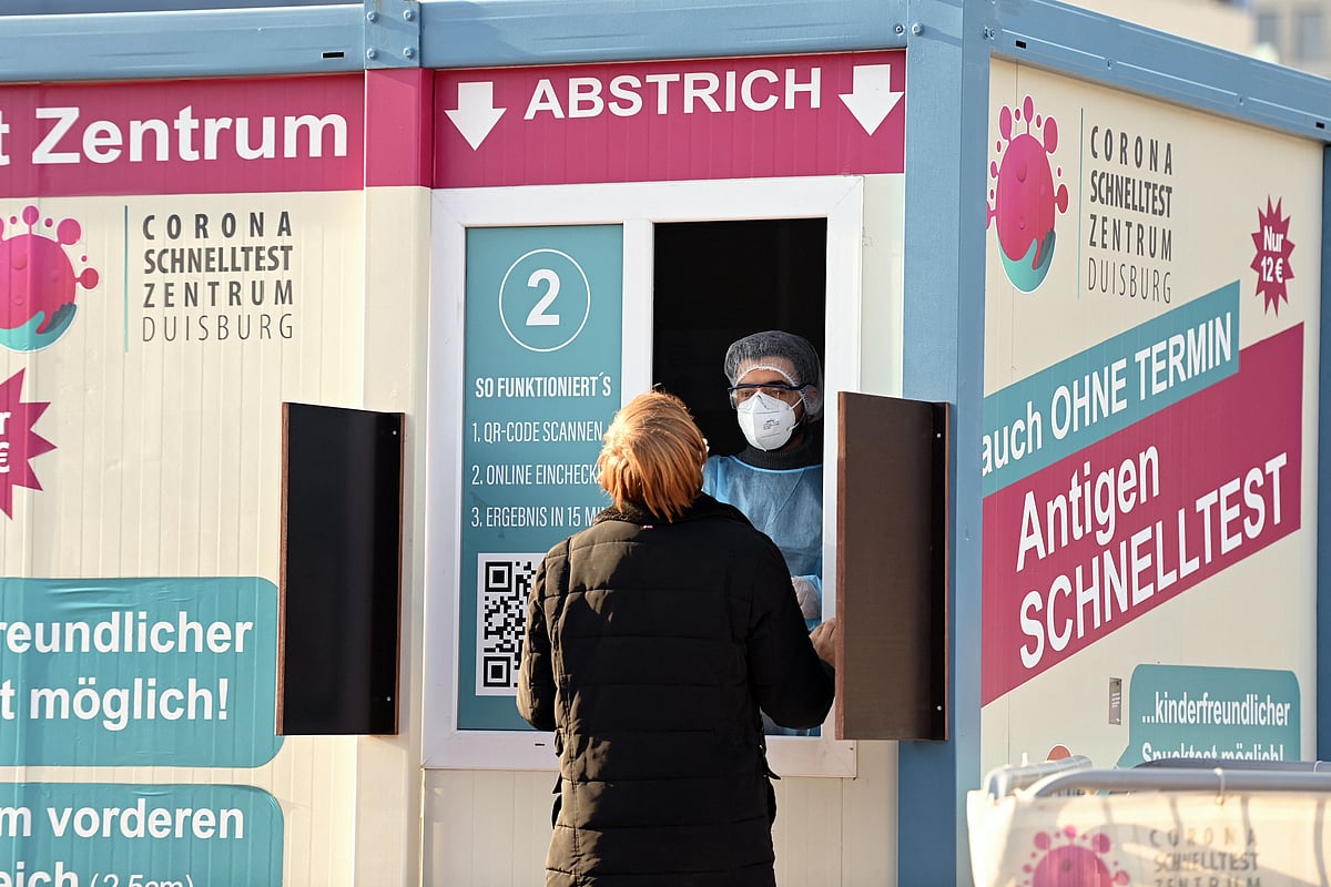 A man is tested at a Corona testing station in Duisburg, western Germany, on 12 November, 2021, amid the ongoing coronavirus Covid-19 pandemic