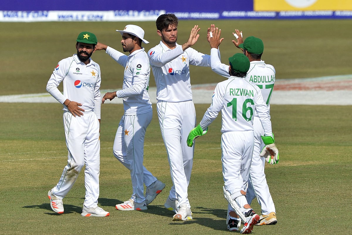 Pakistan's Shaheen Shah Afridi (C) celebrates with teammates after taking the wicket of Bangladesh's Liton Das (not pictured) on the fourth day of the first Test cricket match between Bangladesh and Pakistan at the Zahur Ahmed Chowdhury Stadium in Chittagong on November 29, 2021