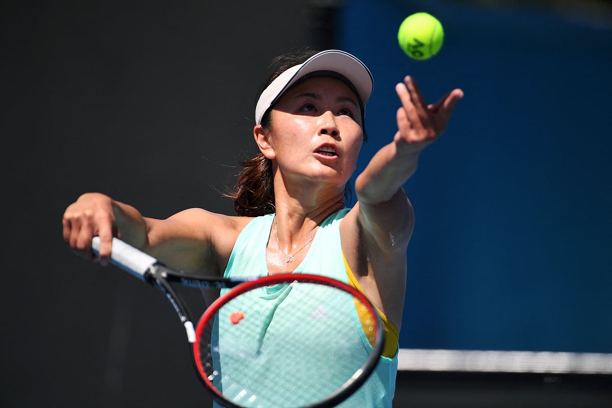 This file photo taken on 13 January, 2019 shows China's Peng Shuai serving the ball during a practice session ahead of the Australian Open tennis tournament in Melbourne