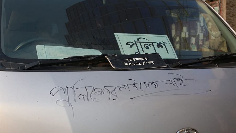 Demonstrating students wrote 'Police has no licence' on a vehicle which did not have documents. This picture is taken at Farmgate on Thursday