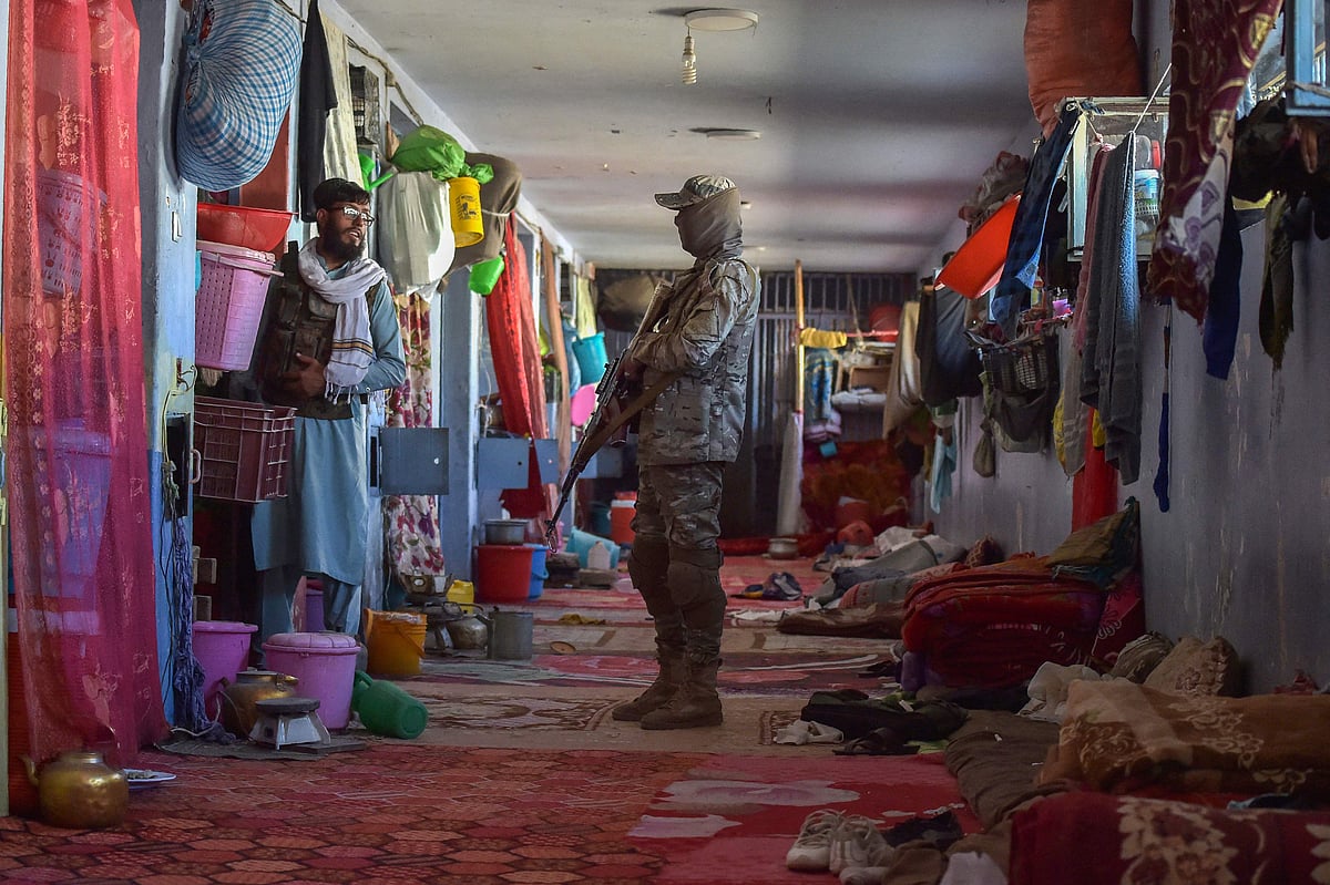 n this file photo taken on 17 October, 2021, Taliban members inspect a prison cell at Pul-e-Charkhi prison, located on the outskirts of Kabul