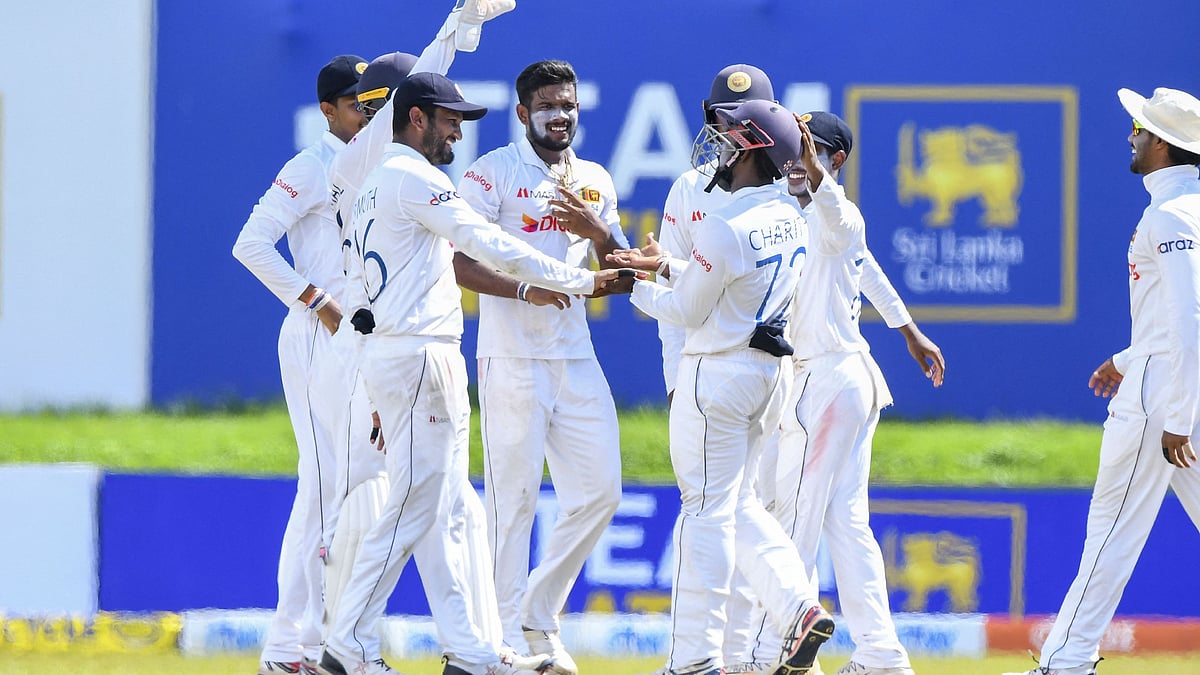ri Lanka's Ramesh Mendis (C) celebrates with teammates after the dismissal of West Indies' Roston Chase (not pictured) during the third day of the second Test cricket match between Sri Lanka and West Indies at the Galle International Cricket Stadium in Galle on 1 December, 2021