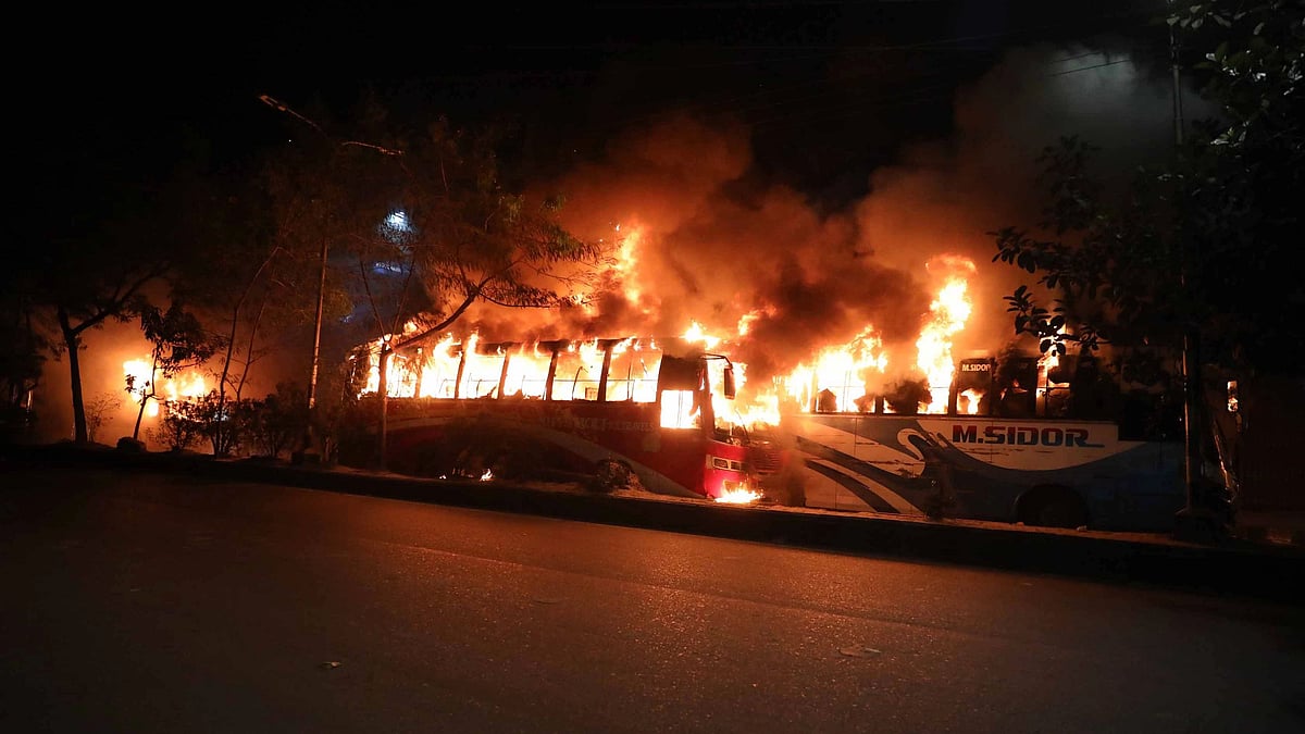 Agitated people vandalise a few buses and set fire to those in Rampura Bridge area, Dhaka, on 29 November 2021 following the death of a school student in road accident