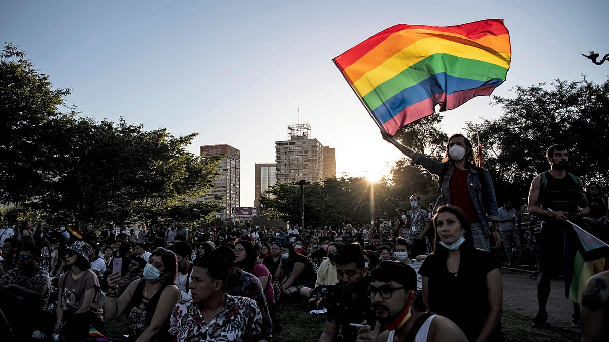 People wait for the passing of a bill to legalize same-sex marriage in Chile, in Santiago, on 7 December 2021.