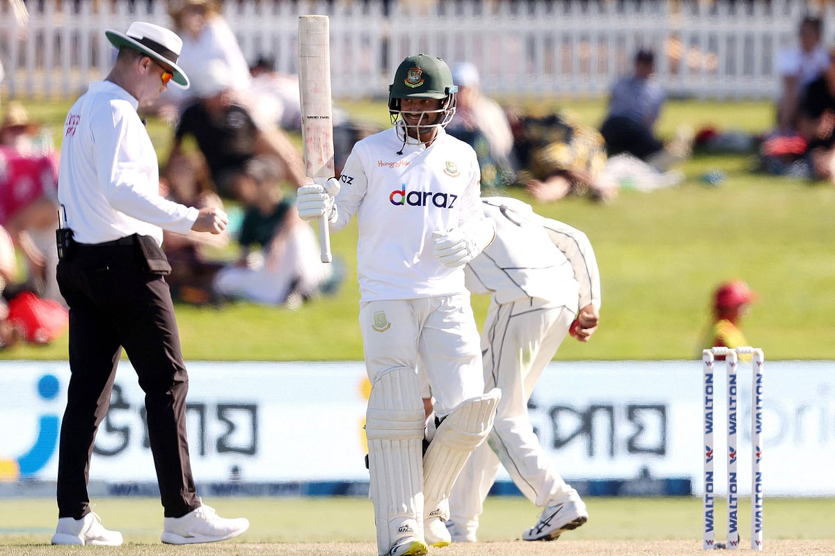Bangladesh's batsman Mahmudul Hasan Joy celebrates reaching his half century (50 runs) on day two of the first cricket Test match between New Zealand and Bangladesh at the Bay Oval in Mount Maunganui on 2 January 2022