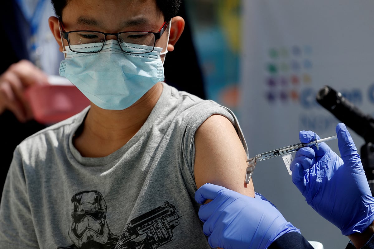 Brendan Lo (13) receives a dose of the Pfizer-BioNTech vaccine for the coronavirus disease (Covid-19) at Northwell Health's Cohen Children's Medical Center in New Hyde Park, New York, US 13 May 2021.