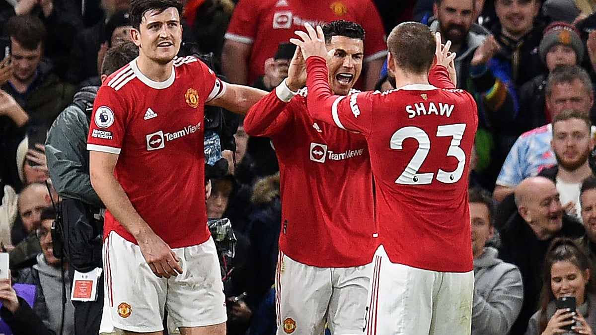 Manchester United's Portuguese striker Cristiano Ronaldo (C) celebrates with teammates after scoring their third goal during the English Premier League football match between Manchester United and Burnley at Old Trafford in Manchester, north-west England, on 30 December, 2021