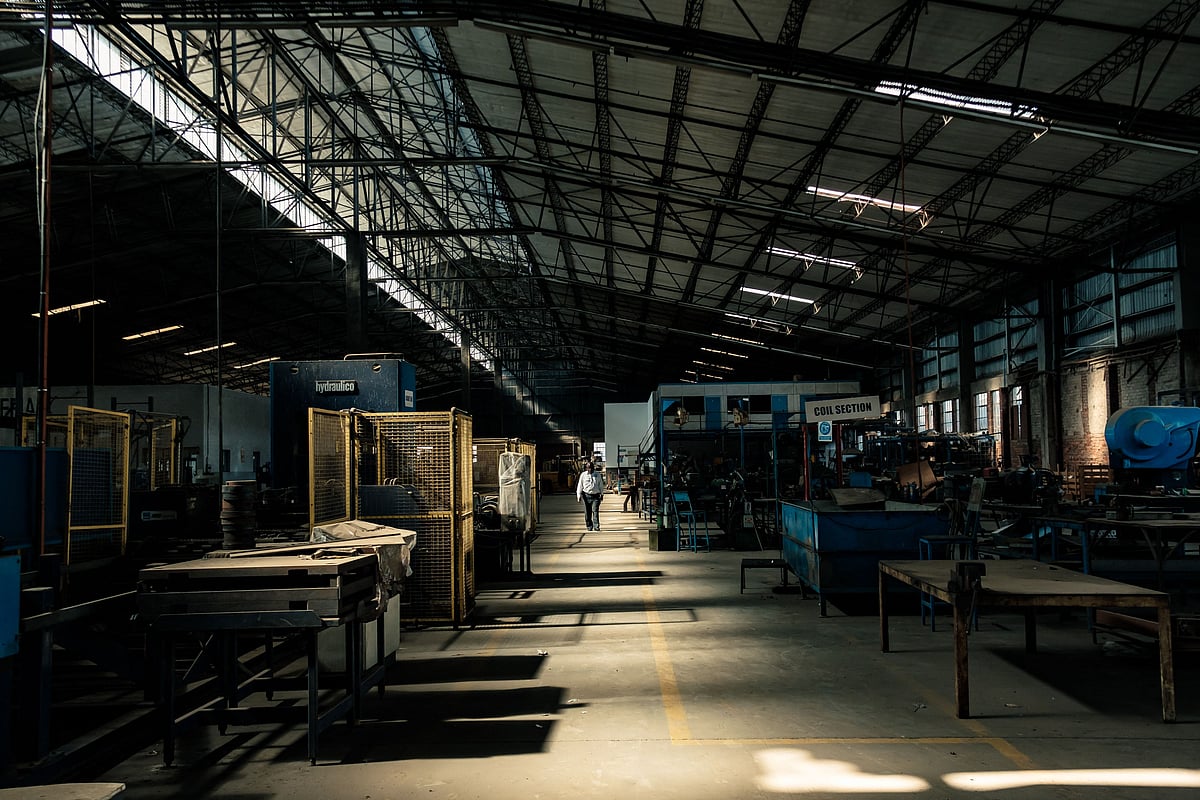 The owner of Imperial Refrigeration, Callisto Jokonya, stands in his refrigerator manufacturing factory in Harare on December 13, 2021, which now only operates at below 10 per cent capacity reducing from a staff of 350 to employing 50 staff after production plummeted, a situation he blames on sanctions