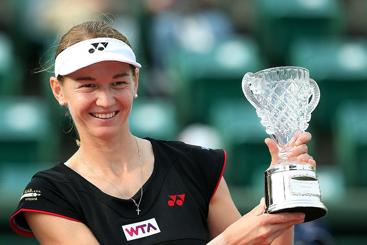In this file photo taken on 12 October 2014 the Czech Republic's Renata Voracova poses with her trophy after winning the women's doubles final at the Japan Women's Open tennis tournament in Osaka, western Japan