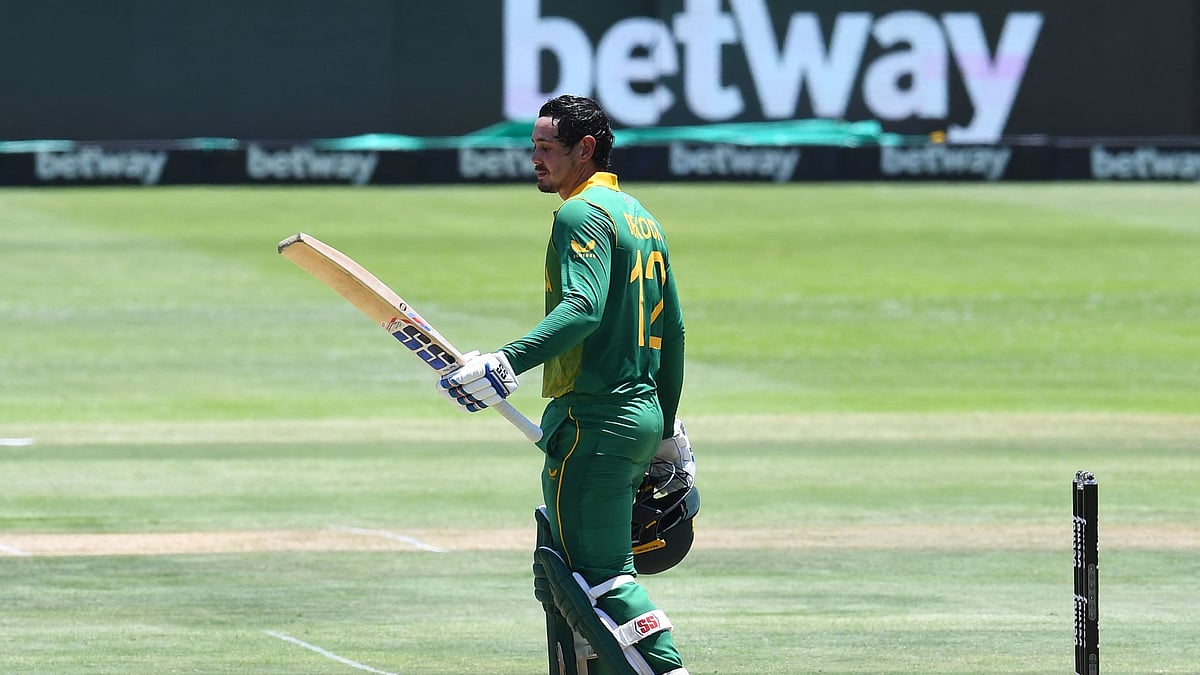 South Africa's Quinton de Kock celebrates after scoring a century (100 runs) during the third one-day international (ODI) cricket match between South Africa and India at Newlands Stadium in Cape Town on 23 January 2022.