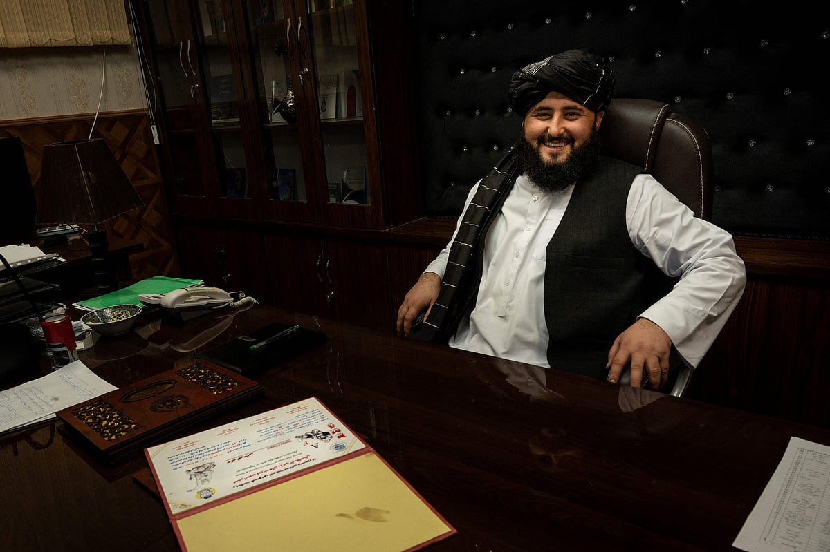 This picture taken on 18 January , 2022 shows Maymana mayor Damullah Mohibullah Mowaffaq posing for a picture at his office in Maymana, capital of Afghanistan's northwestern Faryab province