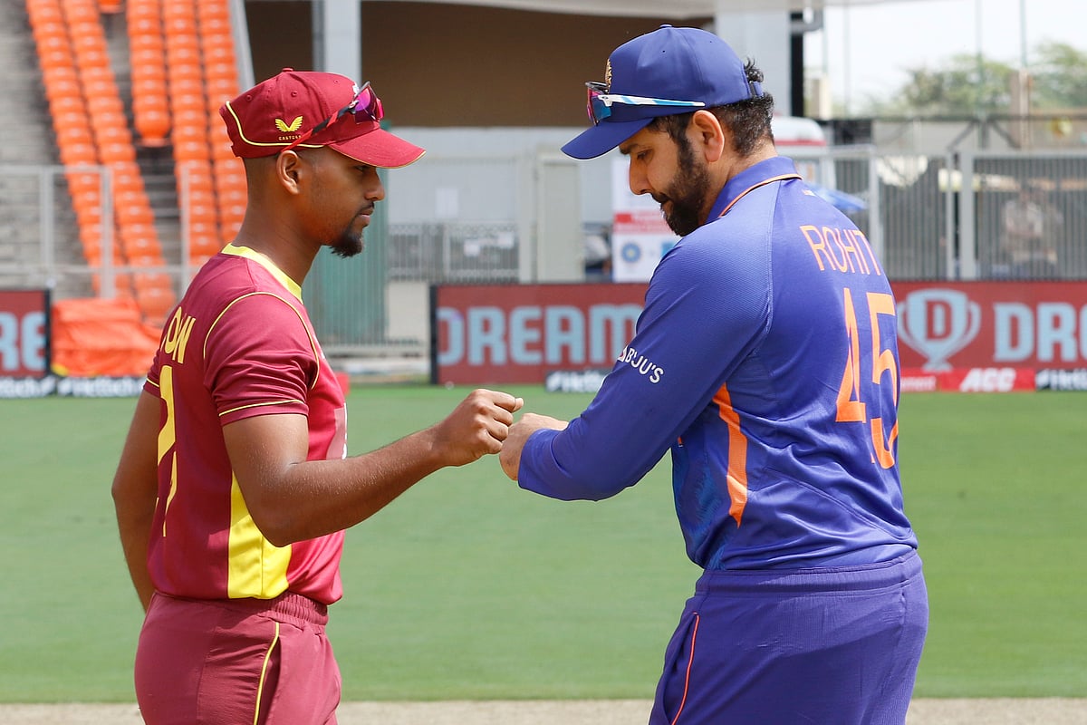 West Indies skipper Nicholas Pooran greets Indian skipper Rohit Sharma after the toss at the Narendra Modi Stadium in Ahmedabad on 9 February, 2022