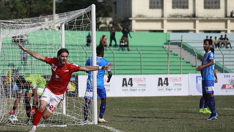 Bashundhara Kings' Bosnian striker Stojan Vranjes celebrates after scoring a goal during a BPL football match against Uttar Baridhara Club at the Bir Shreshtha Matiur Rahman Stadium in Munshiganj on 7 February, 2022