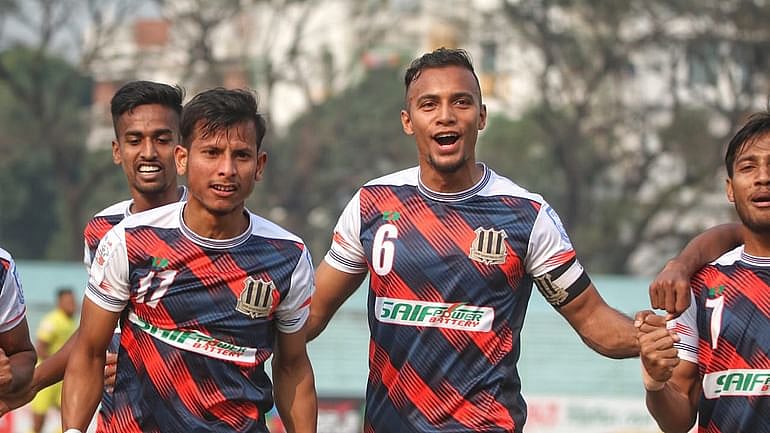 Saif Sporting Club's forward Foysal Ahmed celebrates with skipper Jamal Bhuiyan during a BPL match against Rahamatganj MFS at the Shaheed Flight Lieutenant Matiur Rahman Stadium in Munshiganj on 9 February, 2022