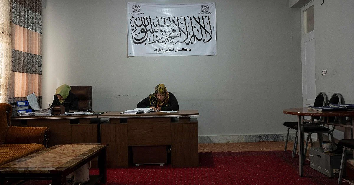 This picture taken on 17 January, 2022 shows a female municipality employee, who has been able to continue working following the Taliban takeover, at her office in Maymana, capital of Afghanistan's northwestern Faryab province