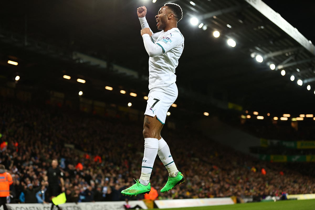 Manchester City's English midfielder Raheem Sterling celebrates after scoring the opening goal of the English Premier League football match between Norwich City and Manchester City at Carrow Road Stadium in Norwich, eastern England, on 12 February, 2022