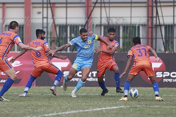 Players of Dhaka Abahani and Police FC vies for during a BPL Football match at the Shaheed  Ahsanullah Master Stadium in Tongi on 8 February, 2022