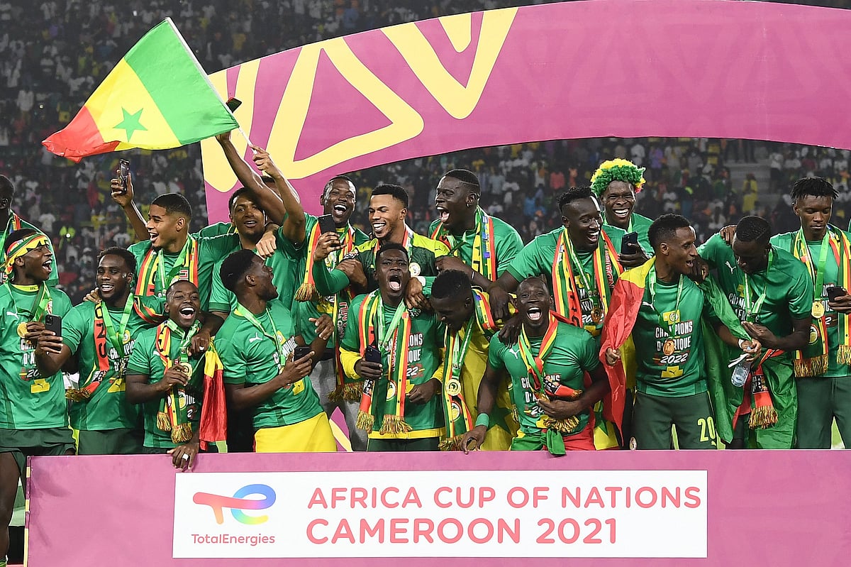Senegal's players celebrate after winning the Africa Cup of Nations (CAN) 2021 final football match between Senegal and Egypt at Stade d'Olembe in Yaounde on
6 February, 2022.
