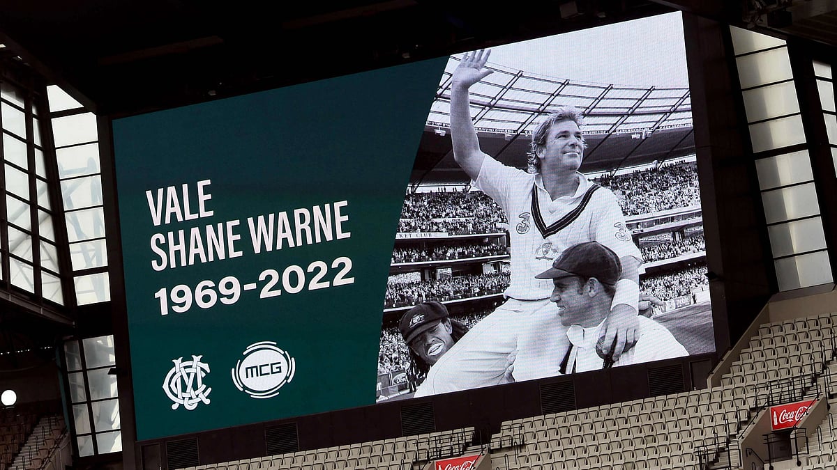 A potrait of former Australian cricketing great Shane Warne looks out over the Melbourne Cricket Ground (MCG) after it was announced the ground's Great Southern Stand will be renamed after Warne, in Melbourne on 5 March, 2022