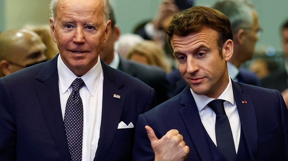 France's President Emmanuel Macron gestures next to U.S. President Joe Biden during a NATO summit to discuss Russia's invasion of Ukraine, at the alliance's headquarters in Brussels, Belgium, 24 March 2022.