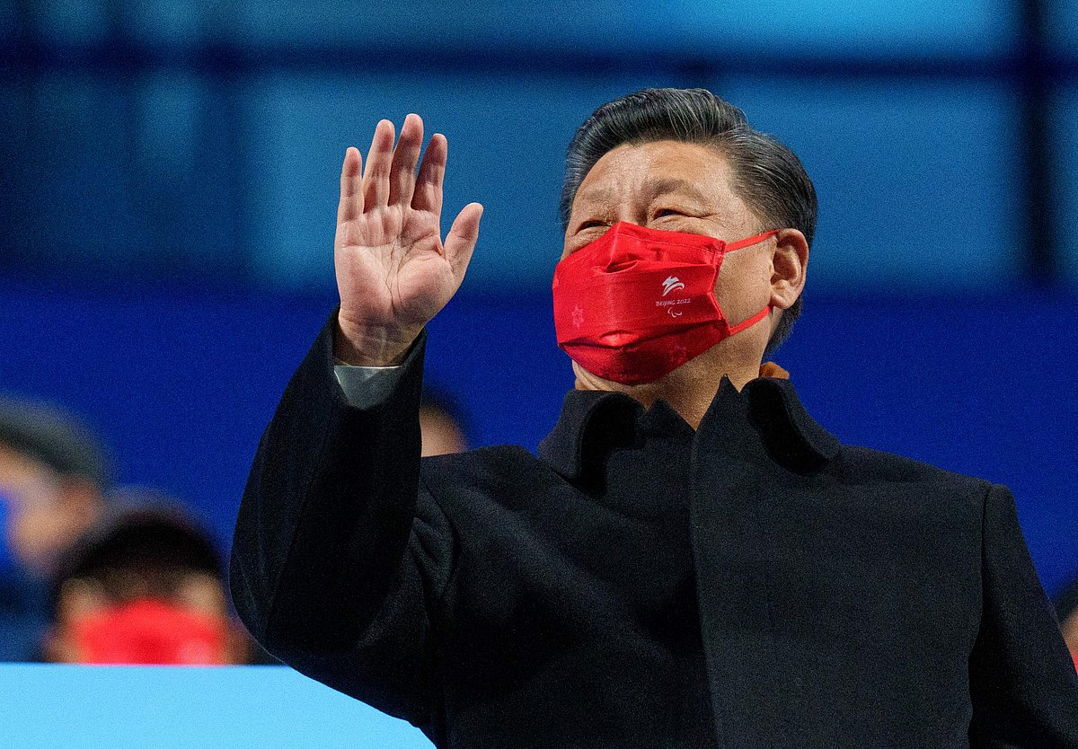 This handout photo taken and received from the OIS/IOC on 4 March, 2022 shows China's President Xi Jinping waving during the opening ceremony of the Beijing 2022 Winter Paralympic Games