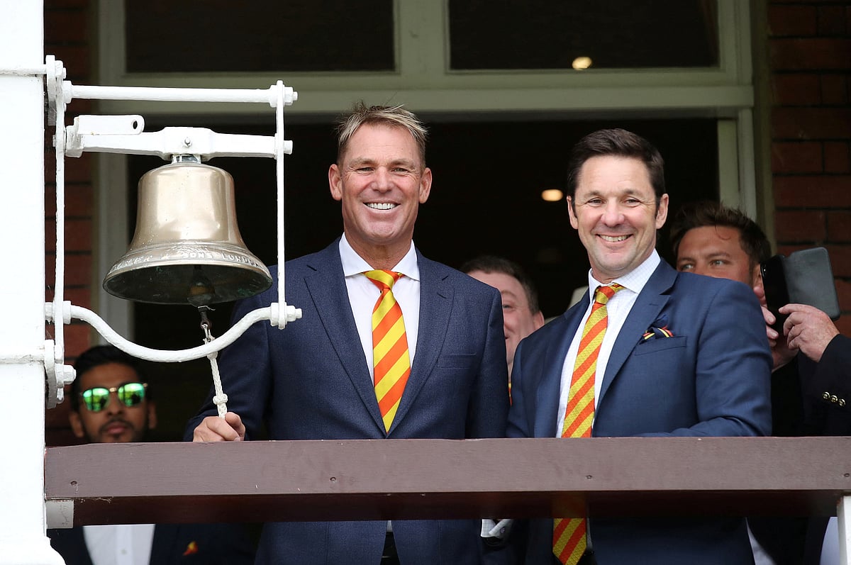 Shane Warne rings the five-minute bell ahead of the start of play at Lord's Cricket Ground, London, Britain
