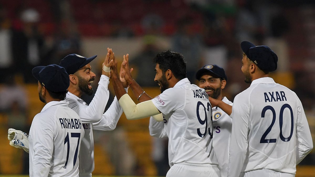 India's Jasprit Bumrah (2R) celebrates with teammates after taking the wicket of Sri Lanka's Kusal Mendis (not pictured) during the first day of the second Test cricket match between India and Sri Lanka at the M. Chinnaswamy Stadium in Bangalore on 12 March, 2022
