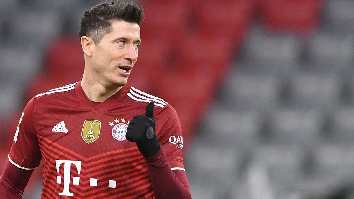 Bayern Munich's Polish forward Robert Lewandowski reacts during the German first division Bundesliga football match Bayern Munich vs VfL Wolfsburg in Munich, southern Germany, on 17 December, 2021