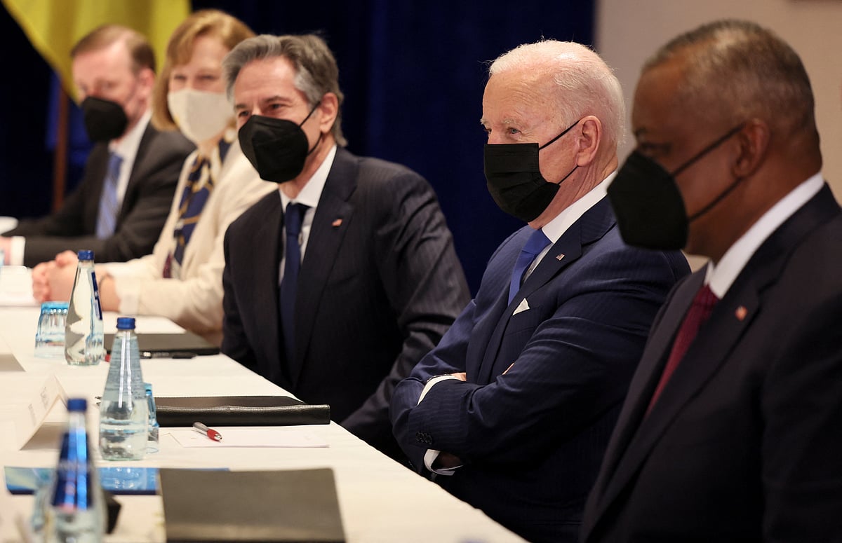 US President Joe Biden (front 4thR) together with US Secretary of State Antony Blinken (front 3rdR hidden) and US Defence Secretary Lloyd Austin (front 3rdL) attend a meeting on Russia's war in Ukraine with Ukrainian Foreign Minister Dmytro Kuleba (back 2ndL) and Ukrainian Defence Minister Oleksii Reznikov (back L) in Warsaw on 26 March, 2022