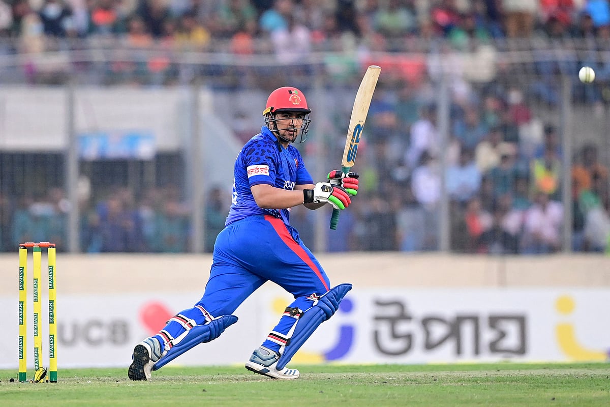 Afghanistan's Hazratullah Zazai watches the ball after playing a shot during the second Twenty20 international cricket match between Bangladesh and Afghanistan at the Sher-e-Bangla National Cricket Stadium in Dhaka on 5 March 2022.