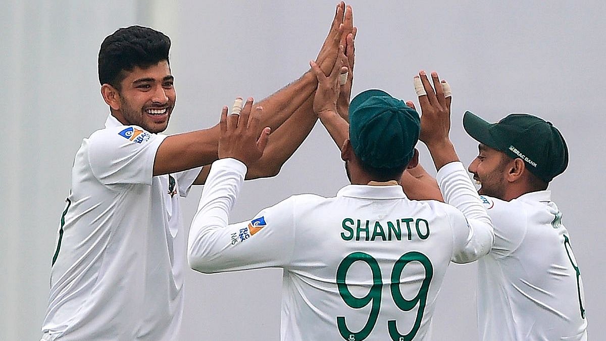 Bangladesh`s Nayeem Hasan (L) celebrates with teammates after the dismissal of the Zimbabwe`s Donald Tiripano during the third day of a Test cricket match between Bangladesh and Zimbabwe at the Sher-e-Bangla National Cricket Stadium in Dhaka on 24 February, 2020