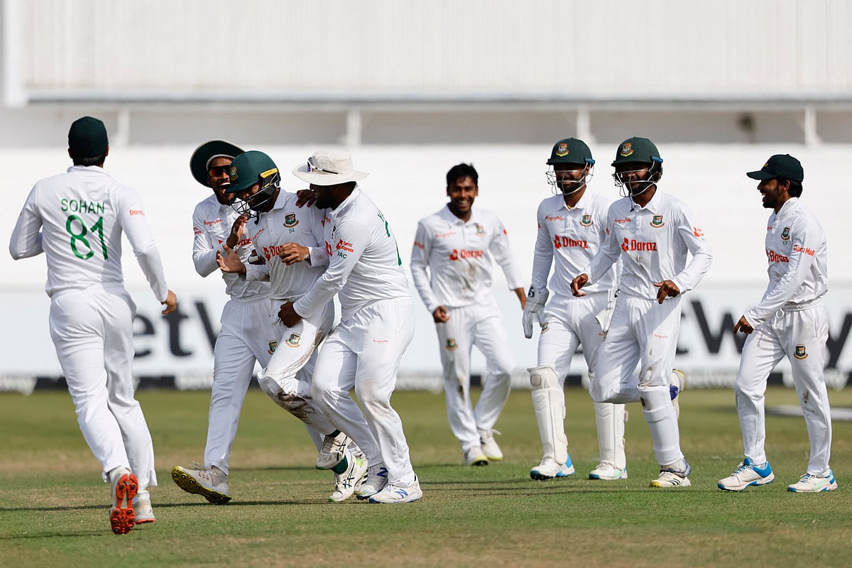 Bangladesh's Shadman Islam (3rd L) celebrates with teammates after the dismissal of South Africa's Kyle Verreynne (not seen) during the fourth day of the first Test between South Africa and Bangladesh at the Kingsmead stadium in Durban on Sunday.