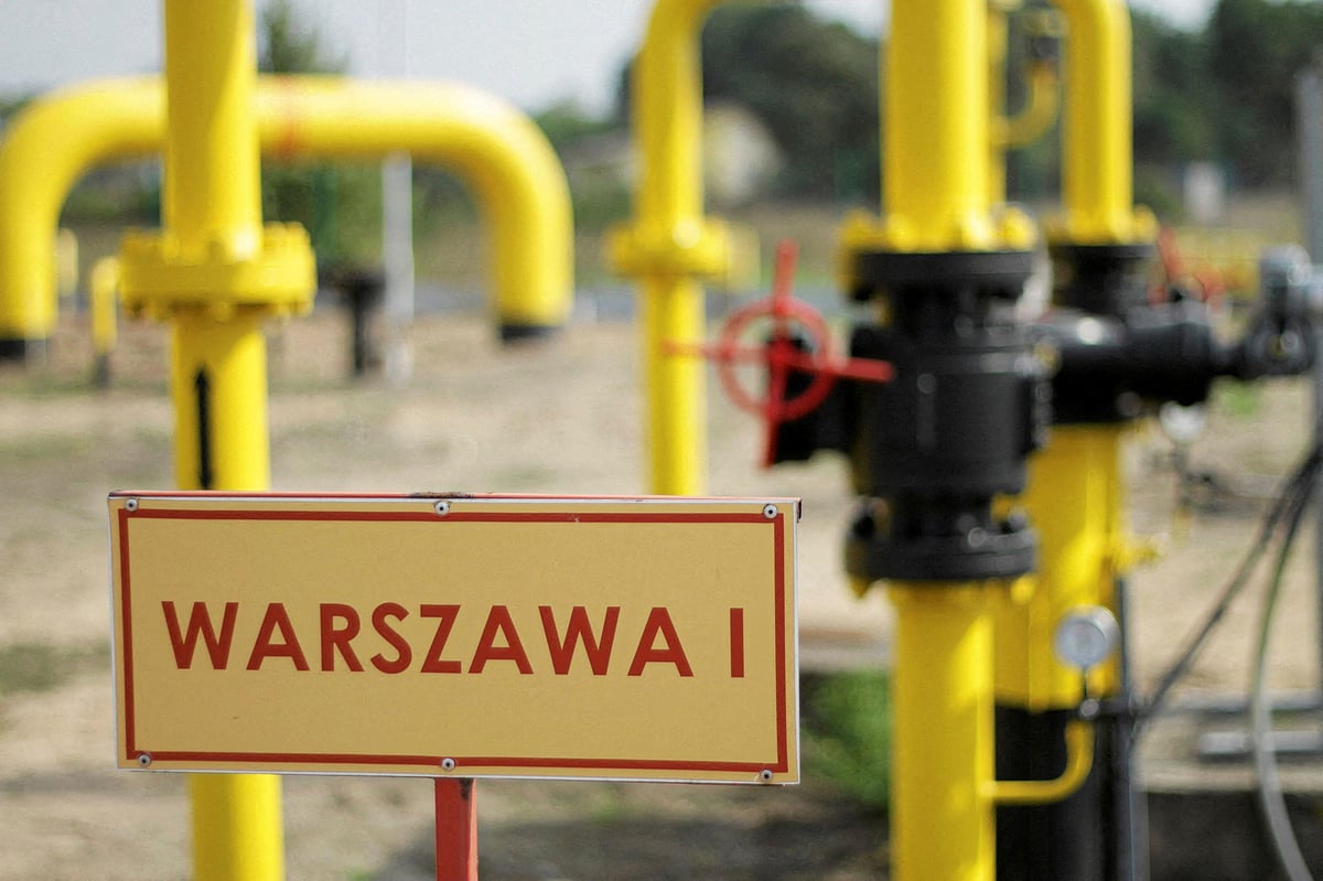 A model of the natural gas pipeline is seen in front of displayed Polish and Russian flag colours in this illustration taken on 26 April, 2022