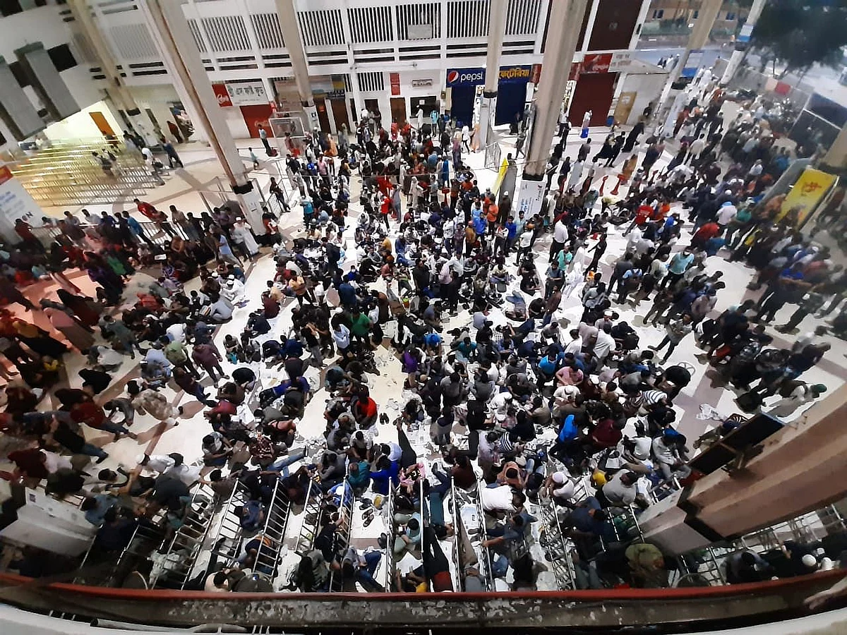 People wait in queue since the night at Kamalapur Railway Station, Dhaka on 23 April 2022 to purchase advance train tickets to travel during Eid-ul-Fitr.