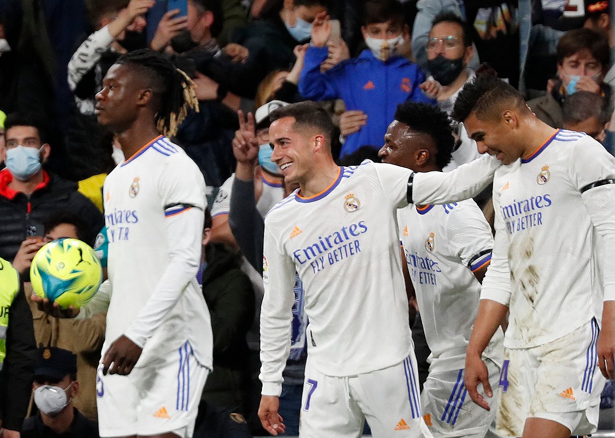 Real Madrid's Casemiro celebrates scoring their first goal with Eduardo Camavinga, Lucas Vazquez and Vinicius Junior