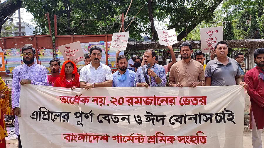 RMG workers hold a human chain demanding Eid bonus and full salary of April in Dhaka on Friday