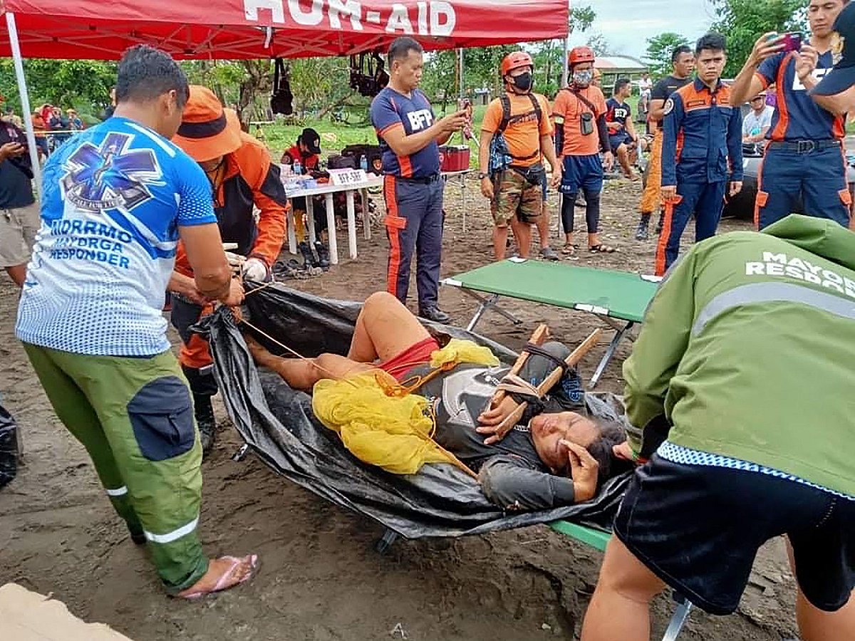 This undated handout photo received from 14TH IB (Avenger Battalion) Philippine Army on 13 April, 2022 shows an injured Pilar Village resident being evacuated to the town
