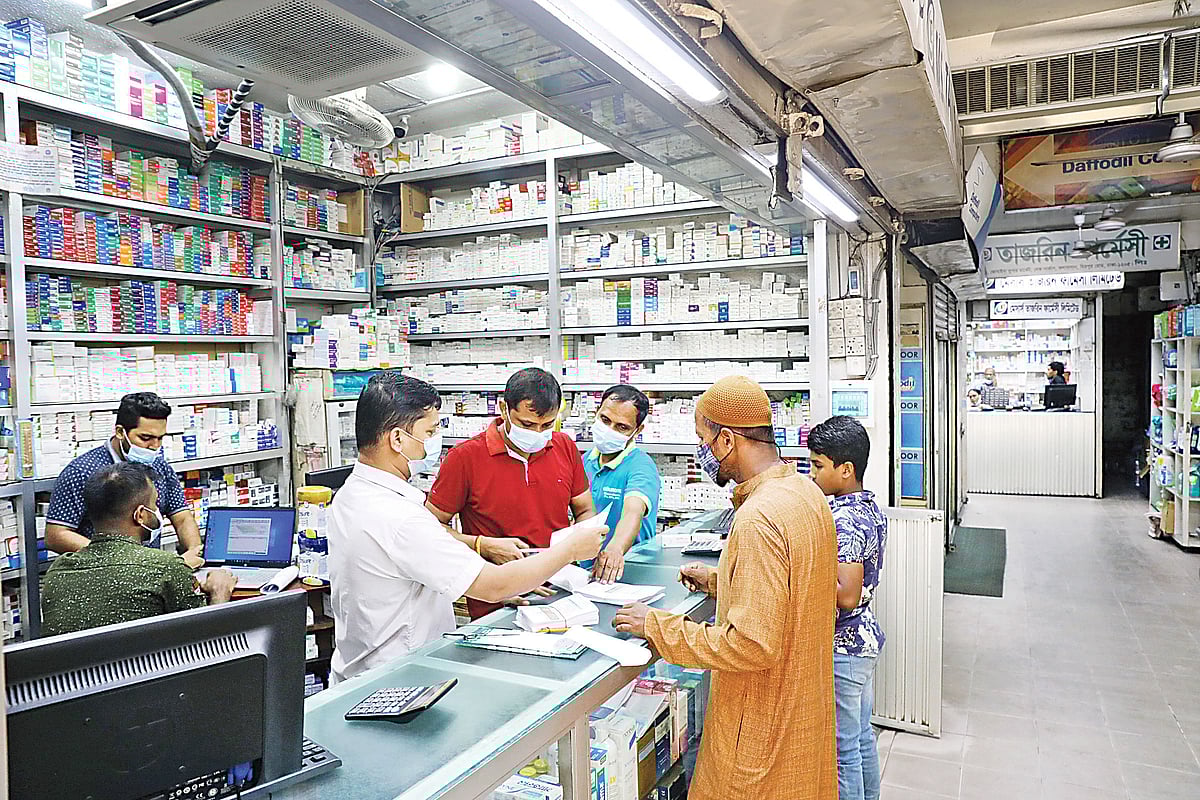 People purchase medicine at a pharmacy in the capital’s Dhanmondi area, Dhaka