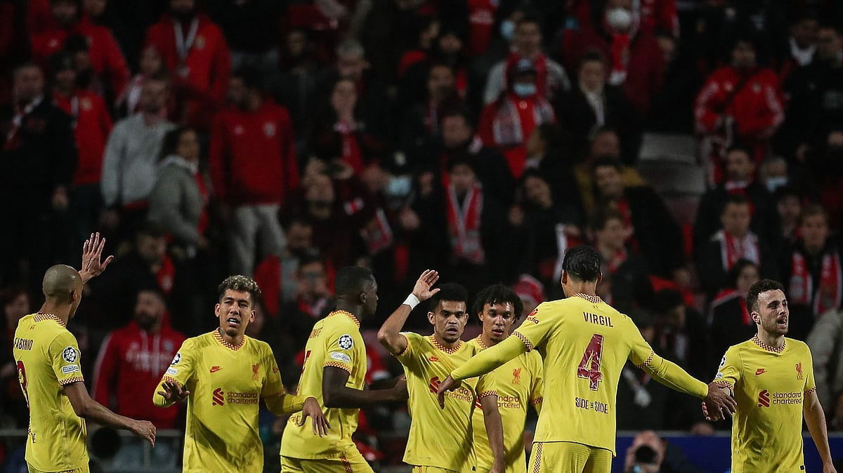 Liverpool's Colombian midfielder Luis Diaz (C) celebrates with teammates after scoring his team's third goal during the UEFA Champions League quarter final first leg football match between SL Benfica and Liverpool FC at the Luz stadium in Lisbon on 5 April, 2022