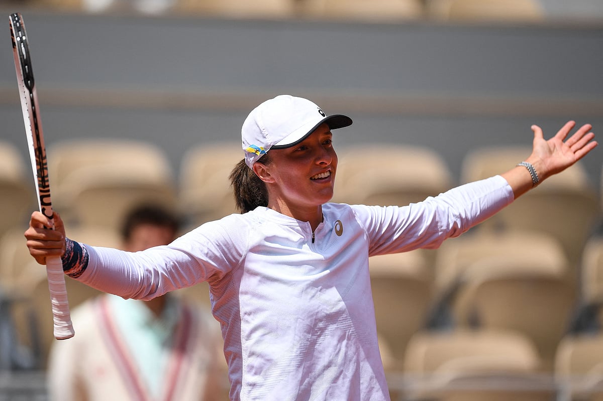 Poland's Iga Swiatek reacts as she plays against Montenegro's Danka Kovinic during their women's singles match on day seven of the Roland-Garros Open tennis tournament at the Court Philippe-Chatrier in Paris on 28 May, 2022