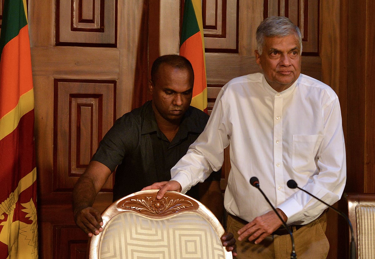 Sri Lanka's prime minister Ranil Wickremesinghe (R)