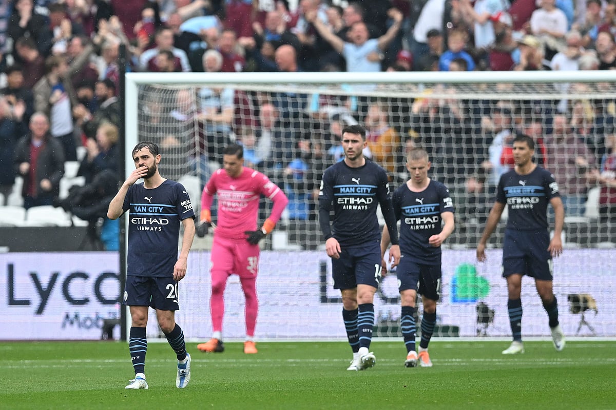Manchester City's players react after West Ham United's striker Jarrod Bowen second goal during their English Premier League match at the London Stadium in London on 15 May, 2022
