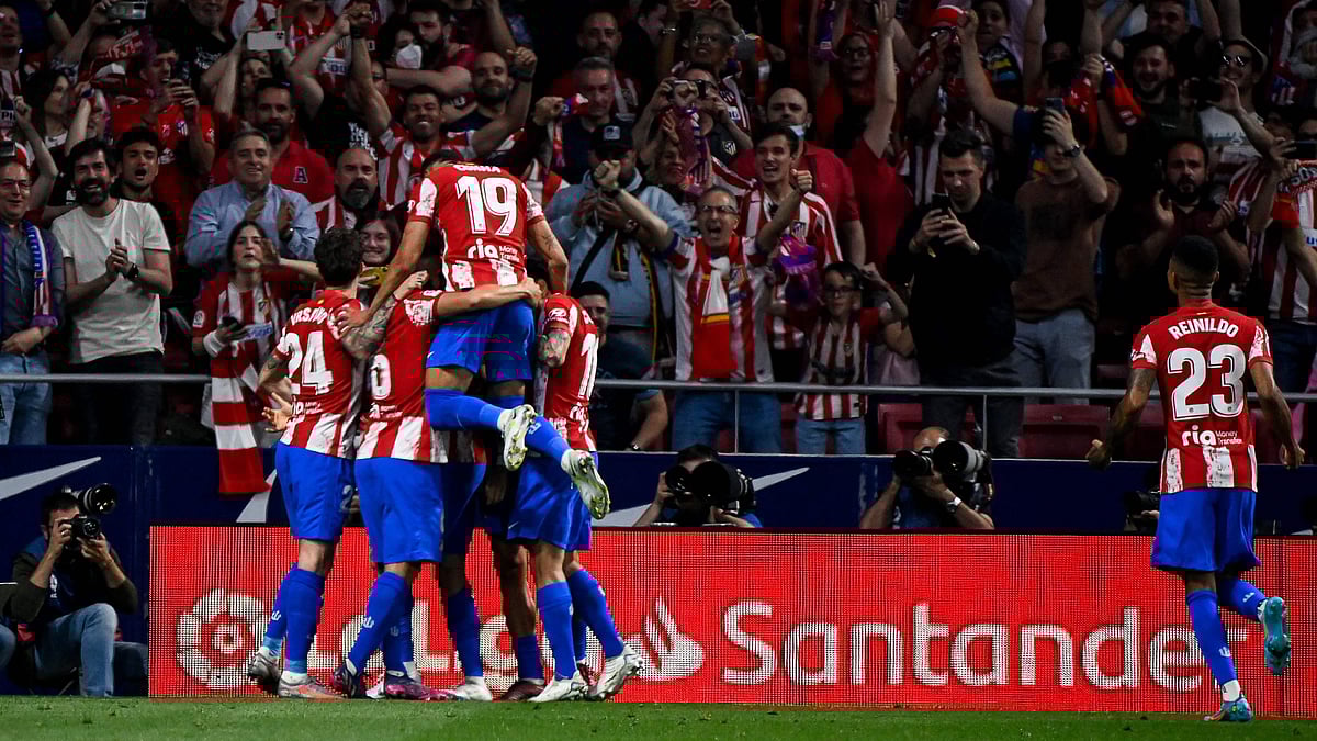 Atletico Madrid's Belgian midfielder Yannick Ferreira-Carrasco celebrates with teammates after scoring his team's first goal during the Spanish League football between Club Atletico de Madrid and Real Madrid CF at the Wanda Metropolitano stadium in Madrid on 8 May, 2022