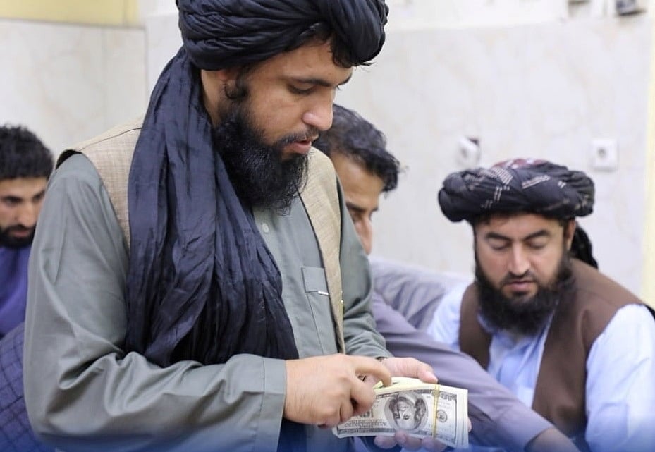 Men are pictured as Afghanistan's Taliban-controlled central bank seizes a large amount of money in cash and gold from former top government officials, including former vice-president Amrullah Saleh, in Afghanistan, in this handout obtained by Reuters on 15 September, 2021