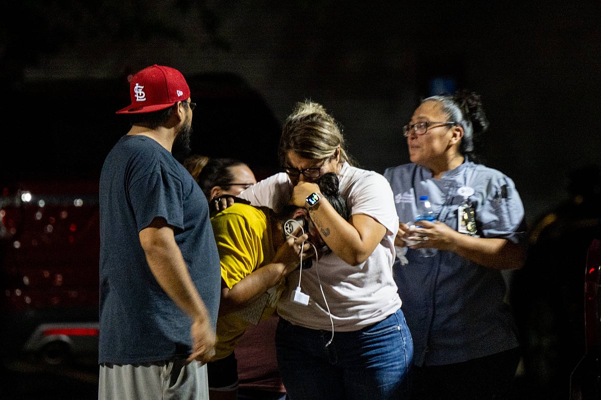 A family grieves outside of the SSGT Willie de Leon Civic Center following the mass shooting at Robb Elementary School on 24 May, 2022 in Uvalde, Texas.
