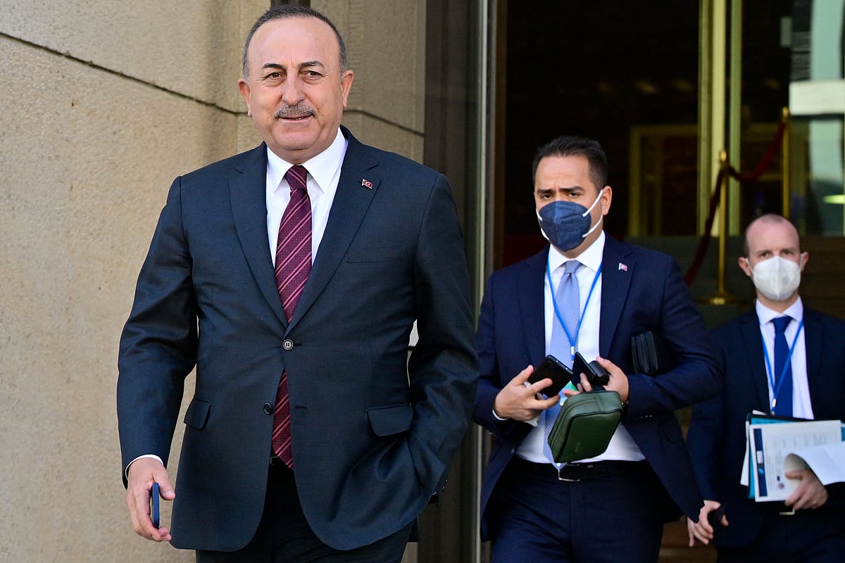 urkish Foreign Minister Mevlut Cavusoglu (L) walks out of the building during a break of an informal meeting of NATO Foreign Ministers on the conflict in Ukraine on 15 May 2022 in Berlin.