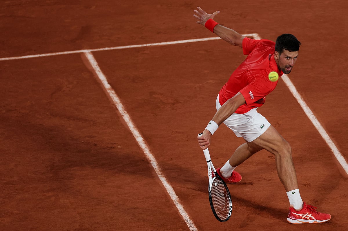 Serbia's Novak Djokovic returns the ball to Japan's Yoshihito Nishioka during their men's singles match on day two of the Roland-Garros Open tennis tournament at the Court Philippe-Chatrier in Paris on 23 May, 2022
